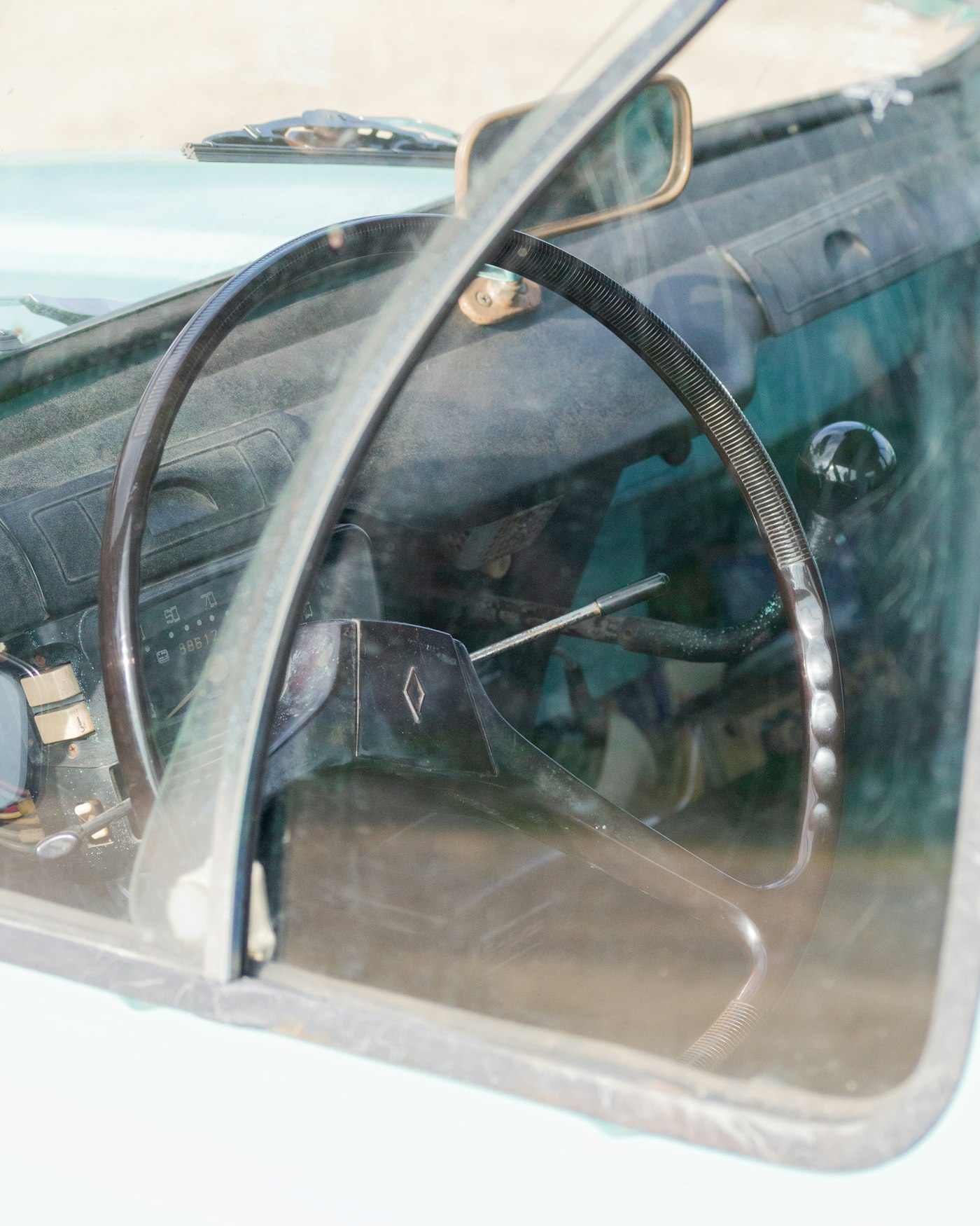 Auto glass technician performing windshield replacement