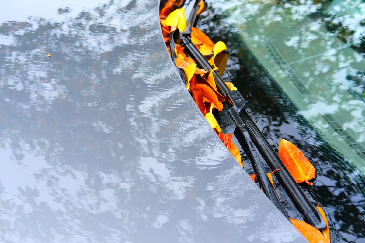 Windshield wipers clearing rain for clear visibility